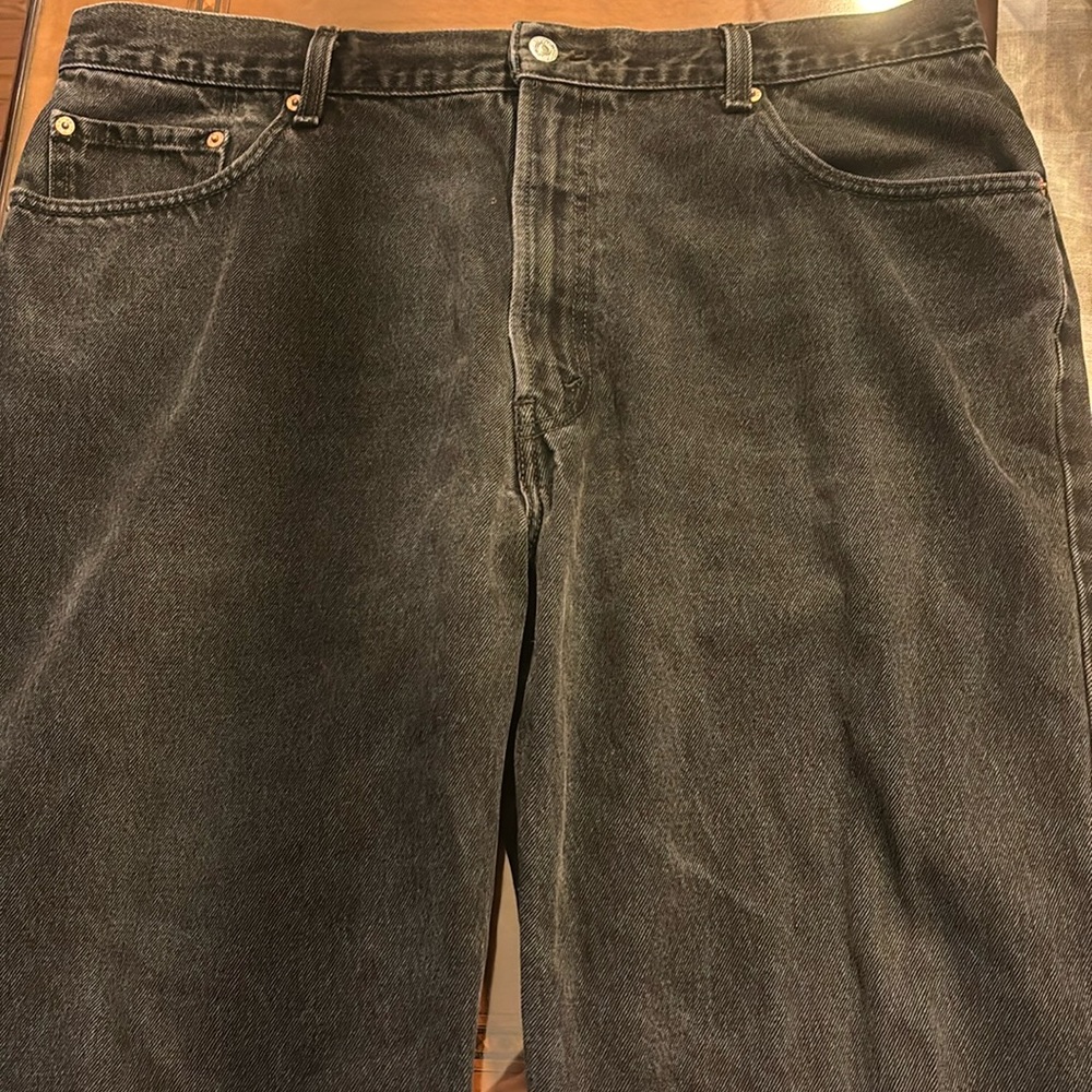 For sale: Levi’s 550 relaxed fit faded black jeans size 40W 29L.